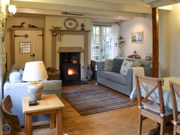 LIVING ROOM WITH DINING AREA & WOOD BURNER