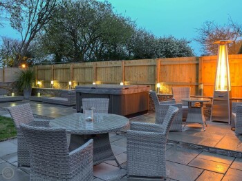 OUTDOOR AREA WITH HOT TUB