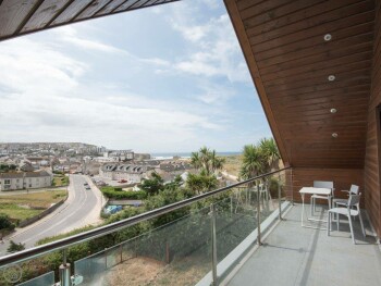 VIEW FROM BALCONY OVER VILLAGE AND TO THE SEA