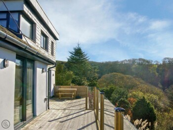 SOUTHWEST FACING SUN DECK WITH PANORAMIC COASTAL AND WOODLAND VIEWS