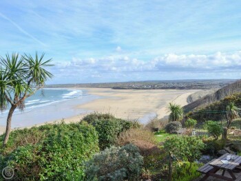 FROM THE PATIO AND OUTDOOR EATING AREA THE VIEW ACROSS ST. IVES BAY IS BREATHTAKING