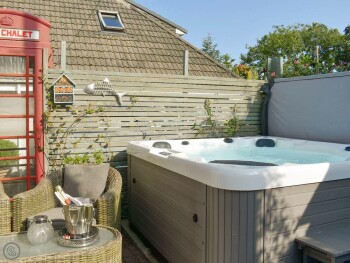 CHARACTERFUL OUTDOOR AREA WITH HOT TUB